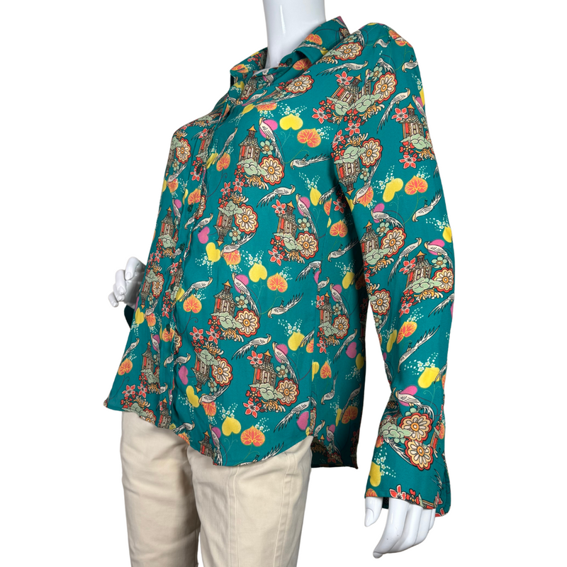 Load image into Gallery viewer, The Shirt Funky Illustrated Shirt is a vibrant long-sleeve button-up shirt features a stunning teal background adorned with an intricate Asian-inspired print - side view
