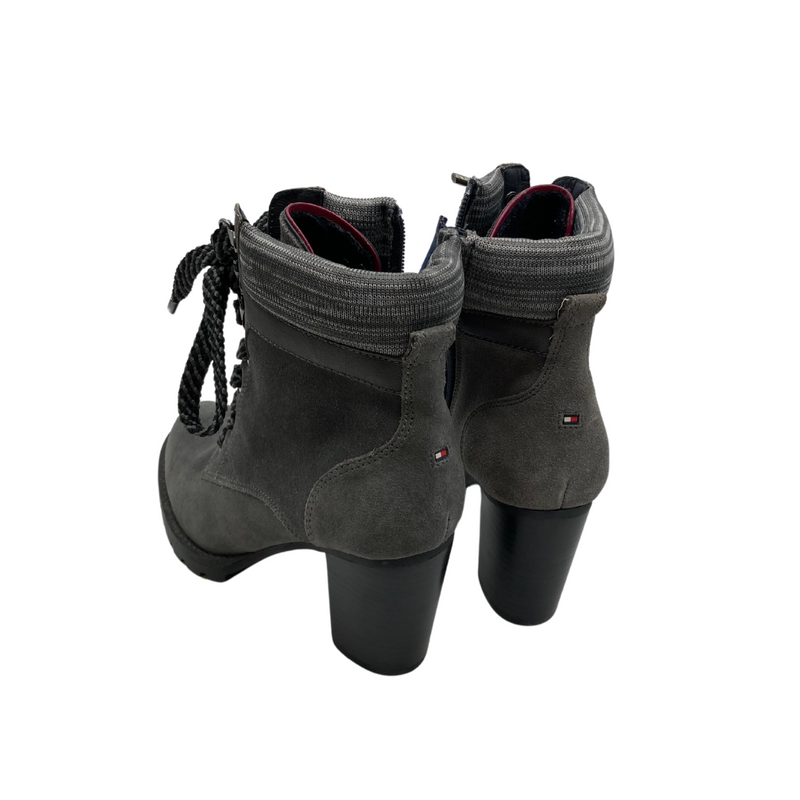 Load image into Gallery viewer, Tommy Hilfiger Grey Heel Boots are trendy heeled ankle boots with a rugged yet stylish design. They feature a lace-up front with bold, thick laces for an edgy look, complemented by a side zipper for easy wear.
