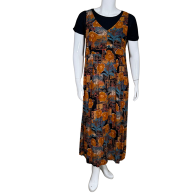 Tori Richard Maxi Polynesian Pattern Vintage Inspired Overlay Maxi Dress features a colorful floral and abstract print in warm orange, teal, and black hues