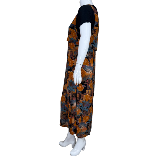 Mannequin wearing a patterned dress with a white background