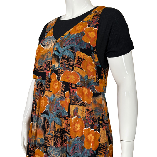 Mannequin wearing a black t-shirt with orange floral and geometric pattern