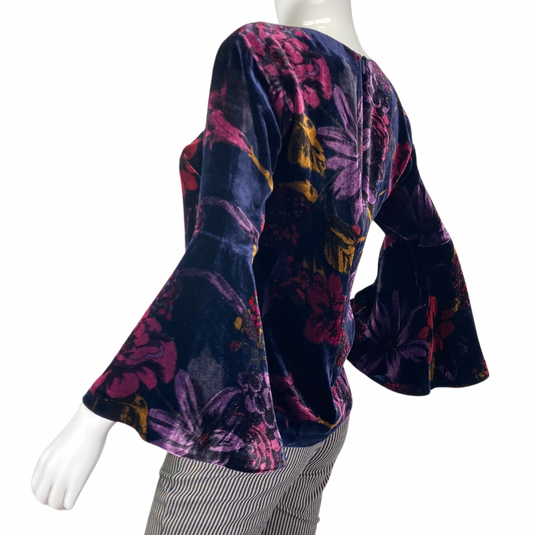 Vibrant floral, luxurious Trina Turk Velvet Top with Bell Sleeves side view featuring the bell slevee design