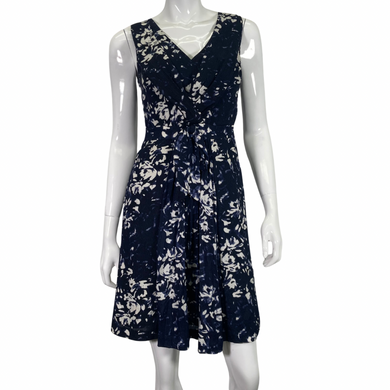 Tory Burch White Floral on Navy-blue Dress, Featuring a unique pattern, flattering silhouette and cinched waist front view