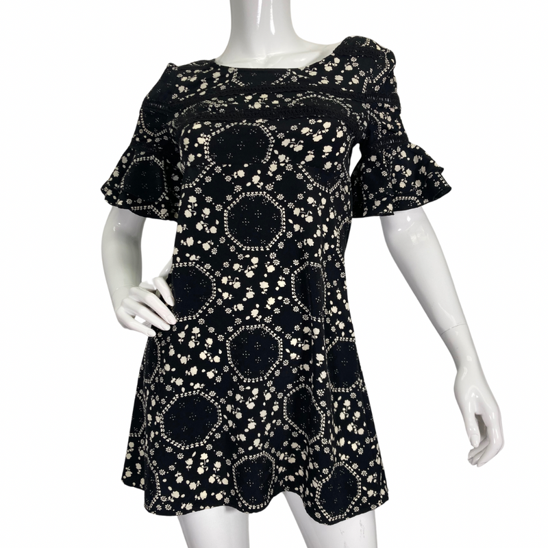 Load image into Gallery viewer, Free People Floral Black and White Dress features an intricate white floral and geometric print, creating a playful yet elegant pattern - front view
