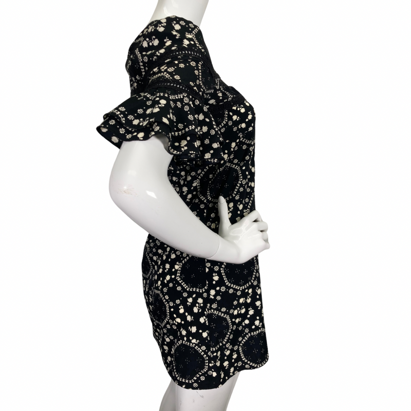 Load image into Gallery viewer, Free People Floral Black and White Dress features an intricate white floral and geometric print, creating a playful yet elegant pattern side view
