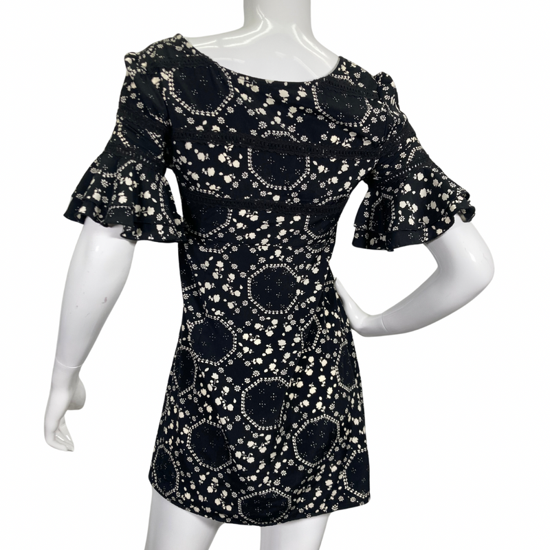 Load image into Gallery viewer, Free People Floral Black and White Dress features an intricate white floral and geometric print, creating a playful yet elegant pattern side view backside view
