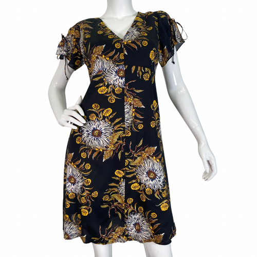 Madewell Black Dress with Bold Floral Pattern features a delicate pattern with white, yellow, and brown tones set against a black background, creating a striking and sophisticated look front view