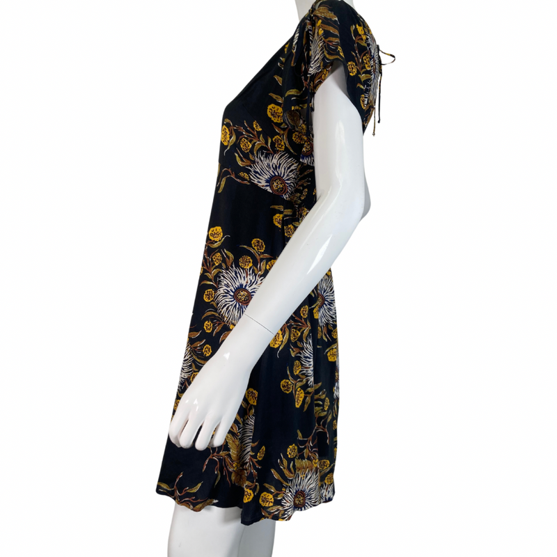 Load image into Gallery viewer, Madewell Black Dress with Bold Floral Pattern features a delicate pattern with white, yellow, and brown tones set against a black background, creating a striking and sophisticated look side view
