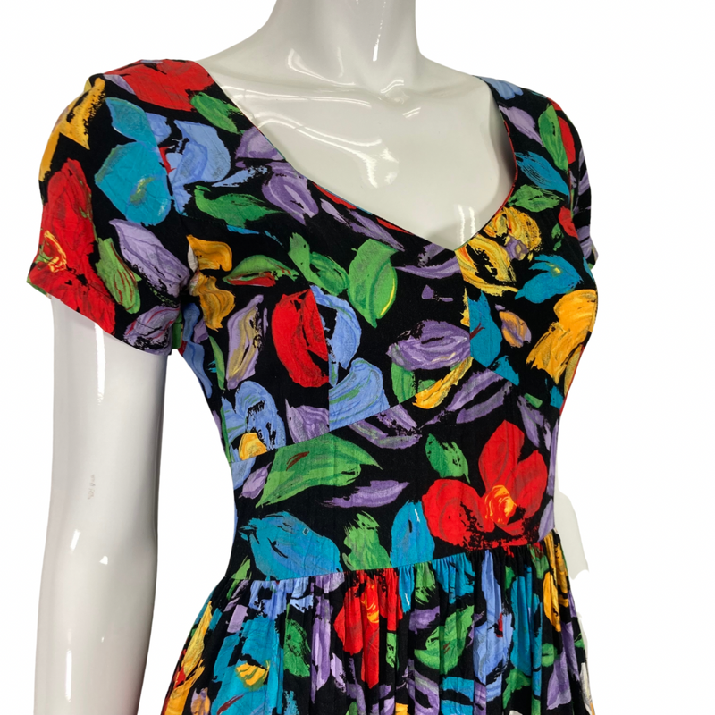 Load image into Gallery viewer, Jam&#39;s World Vibrant Floral Dress close up view of v neck design and waist line
