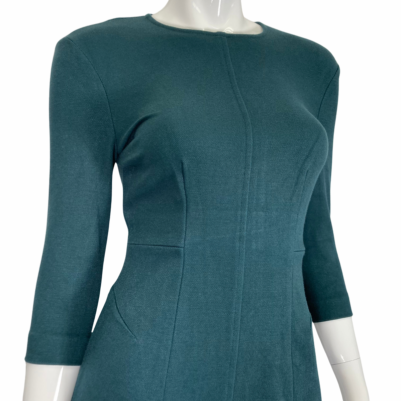 Load image into Gallery viewer, MM Lafleur Opal Green Dress close up of the neckline and top of the dress
