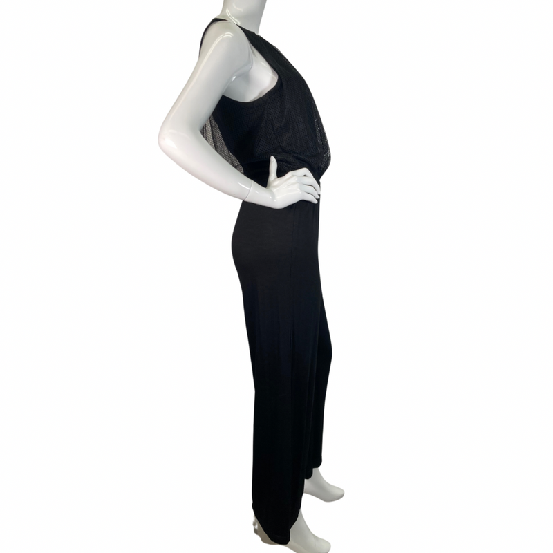 Load image into Gallery viewer, Trina Turk Black Sleek and Stylish Jumpsuit featuring a textured mesh overlay on the bodice for added dimension and elegance - full side view
