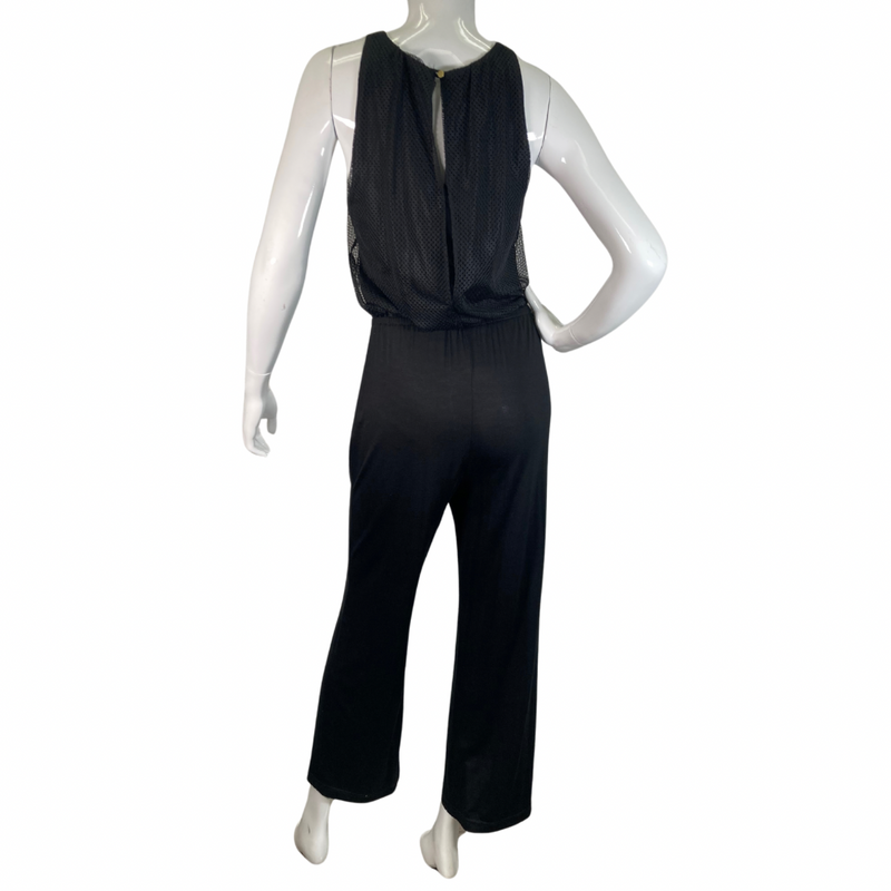 Load image into Gallery viewer, Trina Turk Black Sleek and Stylish Jumpsuit featuring a textured mesh overlay on the bodice for added dimension and elegance - full backside view
