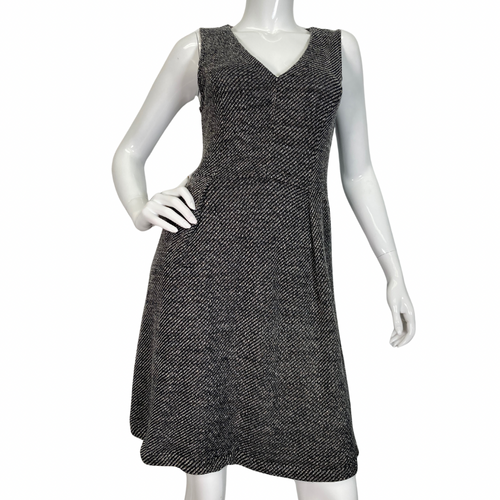 Madewell Grey Knitted Sleeveless Dress features a flattering V-neckline and a textured black-and-white herringbone pattern, creating a timeless and sophisticated look front view