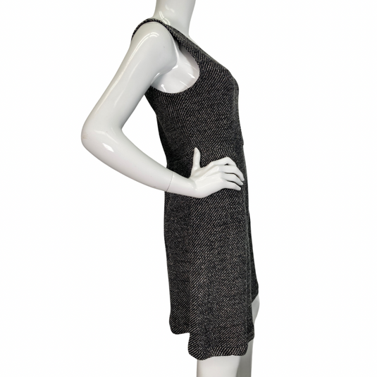 Madewell Grey Knitted Sleeveless Dress features a flattering V-neckline and a textured black-and-white herringbone pattern, creating a timeless and sophisticated look side view