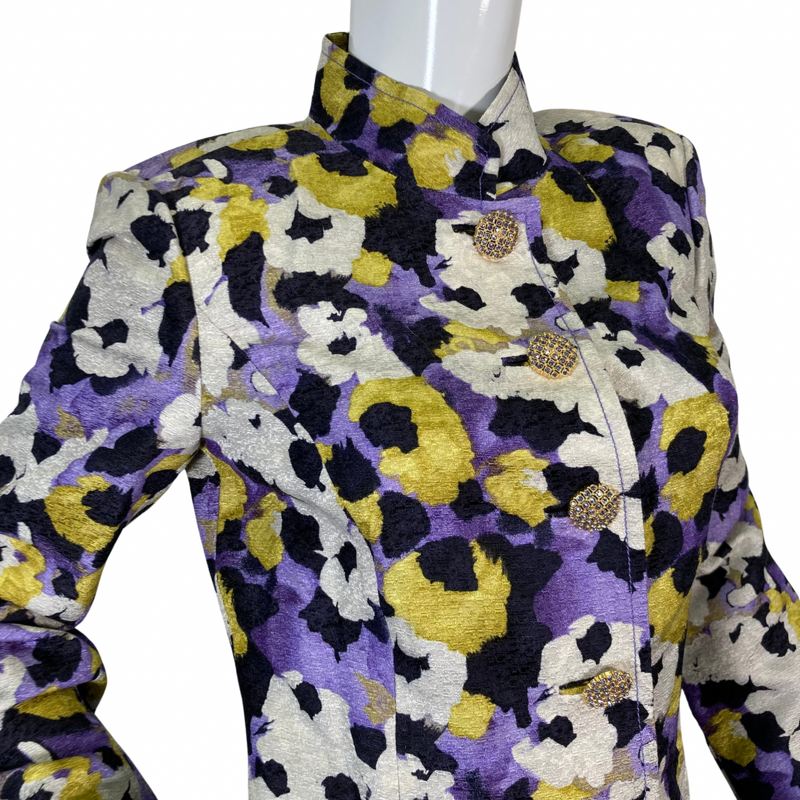 Load image into Gallery viewer, preloved St. John Vibrant Floral-Patterned Jacket features a vibrant a blend of bold mix of purple, yellow, black, and cream hues - close-up view closed buttons
