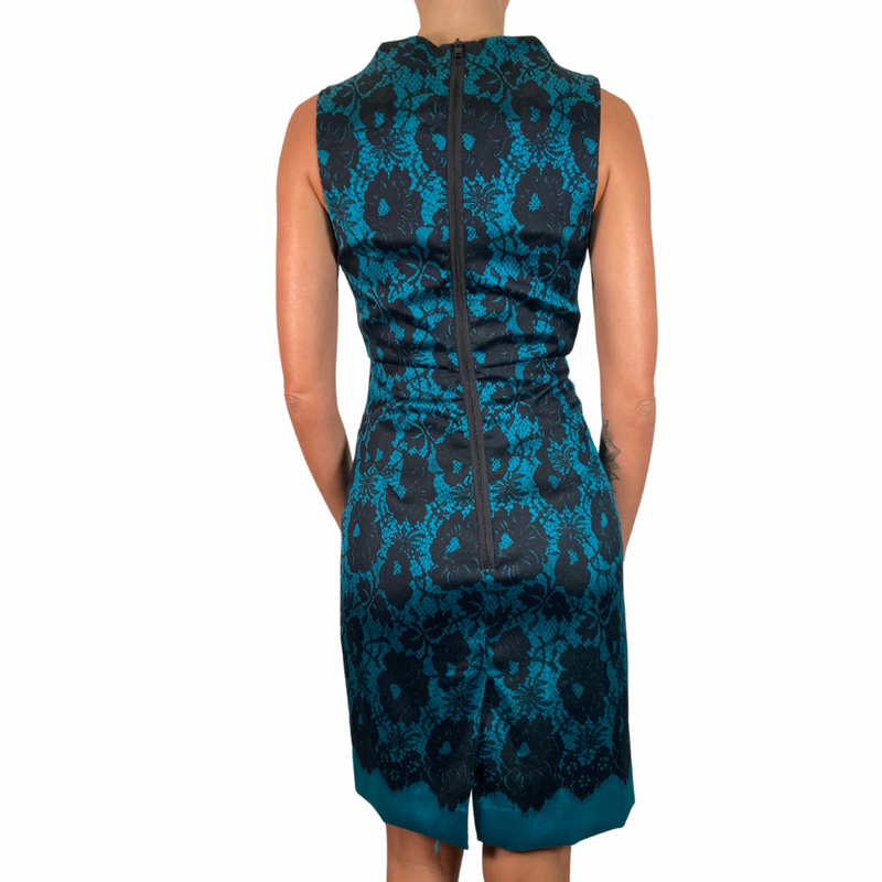 Load image into Gallery viewer, Milly Teal Dress with Black Lace Pattern - sophisticated sleeveless sheath dress featuring a striking teal base with a black floral lace overlay for an elegant and timeless look - backside view 
