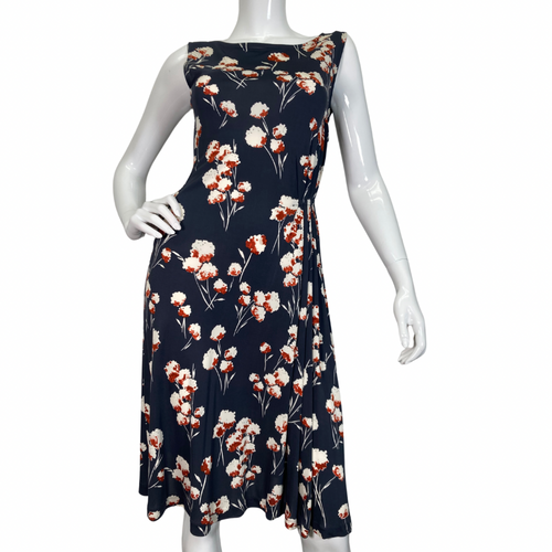 Tory Burch Delicate Floral Midi Dress is a beautiful sleeveless dress, featuring a navy blue base with floral print in white and rust hues - front view