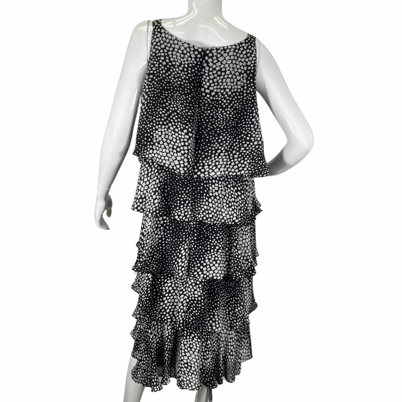 Load image into Gallery viewer, S.L. Fashions charming and playful black and white ruffle dress backside view full length 
