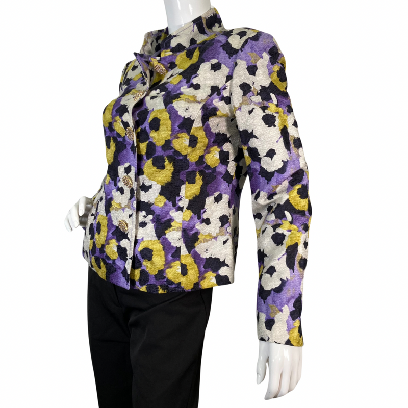 Load image into Gallery viewer, preloved St. John Vibrant Floral-Patterned Jacket features a vibrant a blend of bold mix of purple, yellow, black, and cream hues - side view opened buttons
