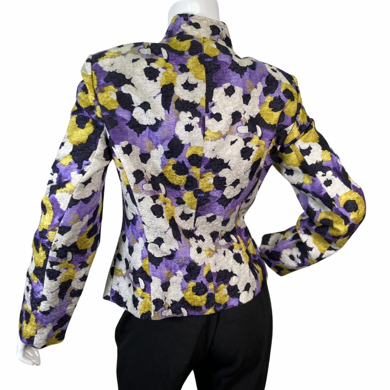 Load image into Gallery viewer, preloved St. John Vibrant Floral-Patterned Jacket features a vibrant a blend of bold mix of purple, yellow, black, and cream hues - backside view opened buttons
