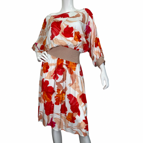 Maeve Floral Cinched Waist Dress is a beautiful, flowy dress featuring a vibrant floral print with shades of red, orange, and pink on a light background front  view