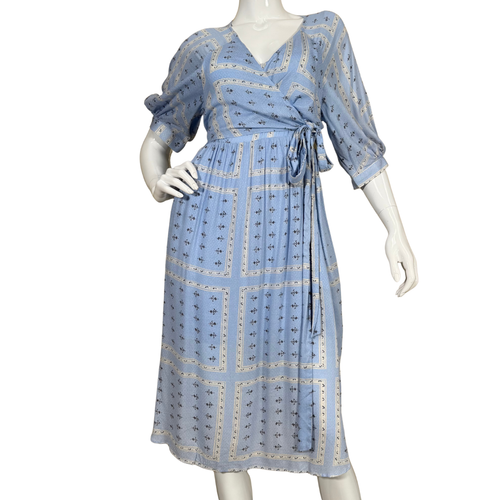 Blue patterned dress on a mannequin against a white background
