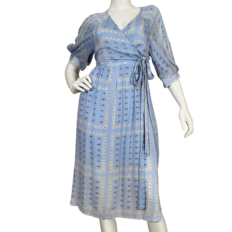 Load image into Gallery viewer, Blue patterned dress on a mannequin against a white background
