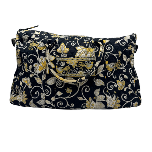 Vera Bradley Black Duffle Bag with Golden and White Design is a quilted fabric bag with a black background and an intricate floral pattern in gold, white, and beige