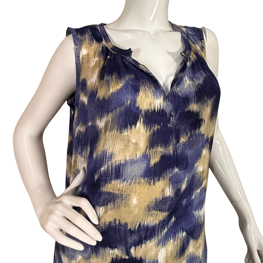 Mannequin wearing a sleeveless top with blue and gold abstract pattern on a white background