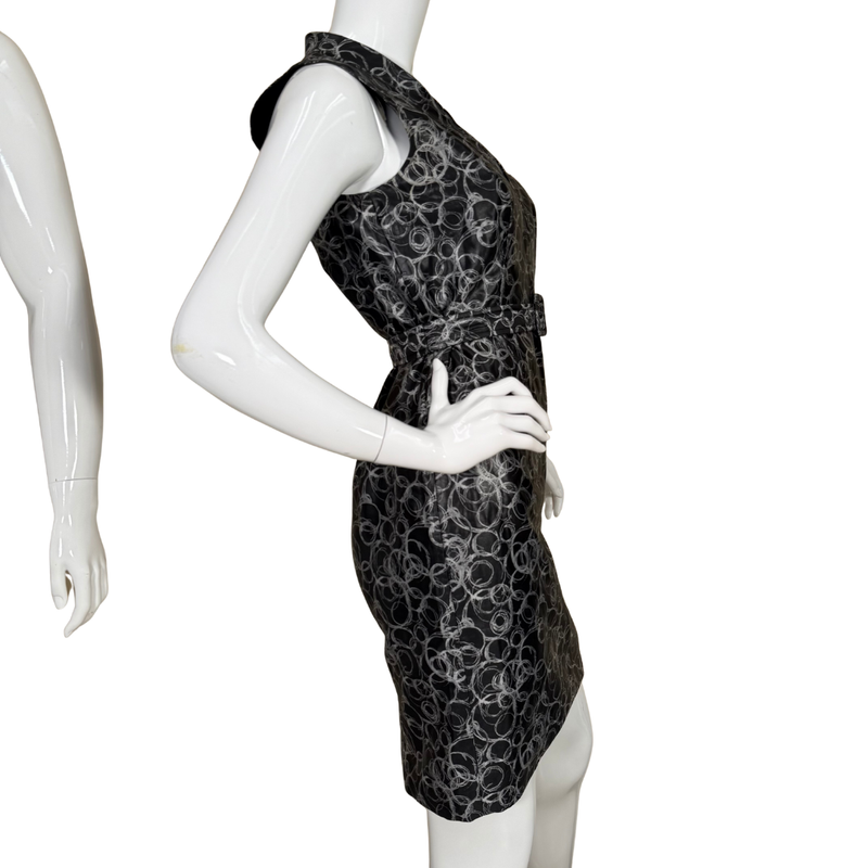 Load image into Gallery viewer, Black patterned dress on a mannequin against a white background

