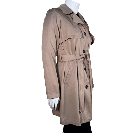 Beige trench coat on a mannequin against a white background
