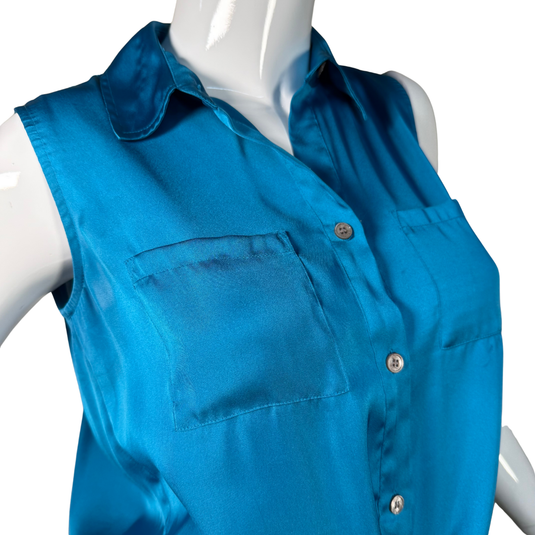Blue sleeveless shirt on a mannequin against a white background