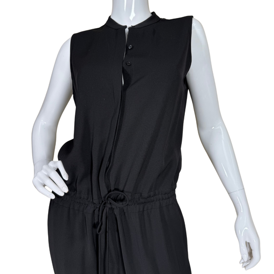 Black sleeveless dress on a mannequin against a white background