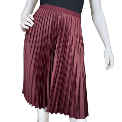 Mannequin wearing a pleated maroon skirt on a white background