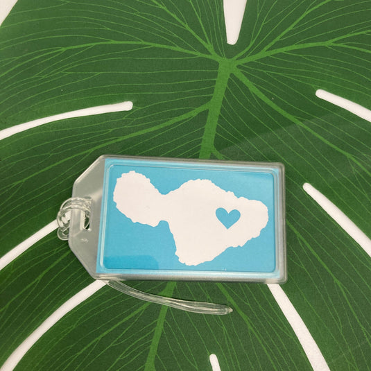 Aloha Christmas Pineapple Set by Matsumoto Studio on leaf showing maui luggage tag