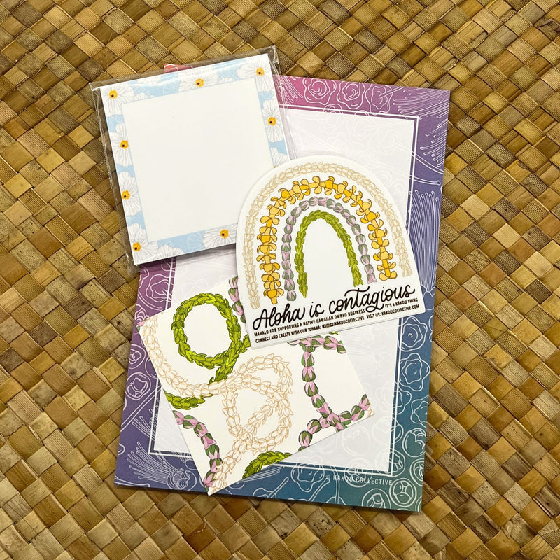 Load image into Gallery viewer, Aloha is Contagious Stationery Set - ShopYWCA. kakou collective design on purple and blue paper 
