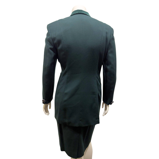 Green coat on a mannequin against a white background